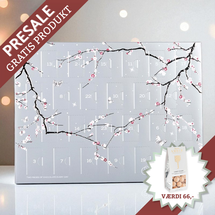 Elegant Summerbird julekalender med økologisk luksuschokolade – dansk håndværk i topklasse, sølvskinnende og sofistikeret design.