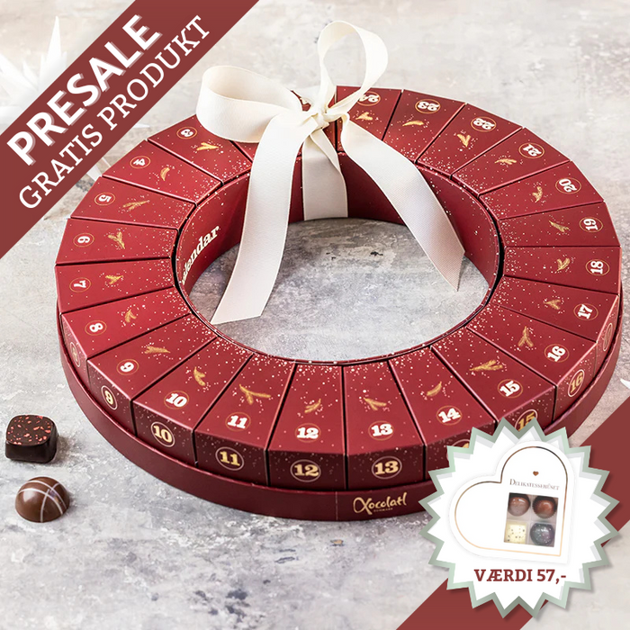 Julekrans-julekalender fra Xocolatl – 24 æsker samlet i en smuk krans, hver med to fyldte danske chokolader med bl.a. karamel, ganache og nougat.
