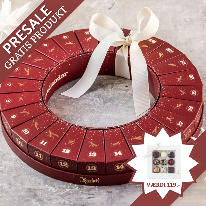 Julekalender fra Xocolatl – 24 æsker samlet i en smuk krans, hver med to fyldte danske chokolader med bl.a. karamel, ganache og nougat.	