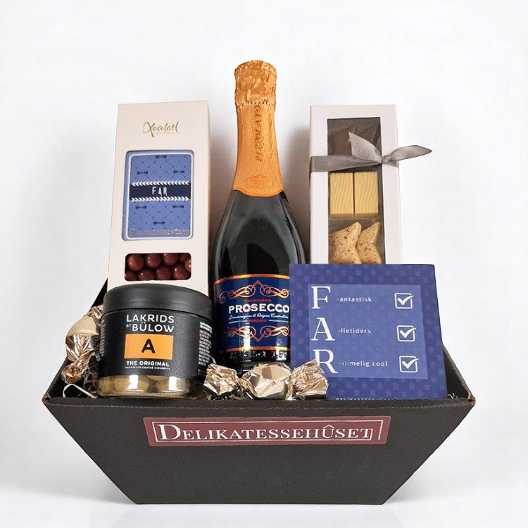 Gavekurv til Fars dag med en lille flaske prosecco, Lakrids by Bülow, Summerbird chokolade og sprøde kiksekugler. Gør din far glad på Fars dag. 