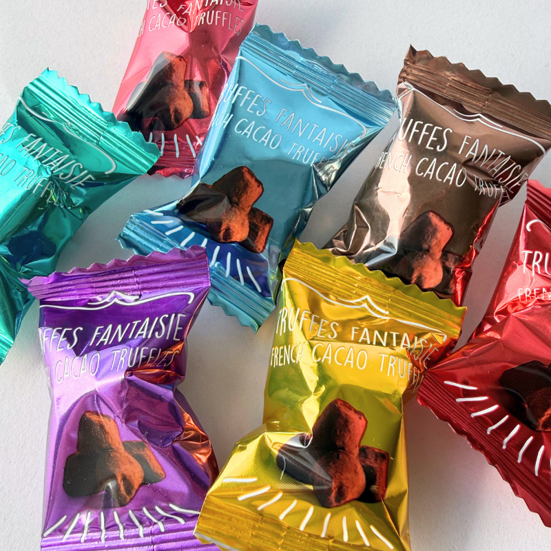 Weibel mix med syv enkeltindpakkede chokoladetrøfler i forskellige foliefarver - ekstra produktfoto