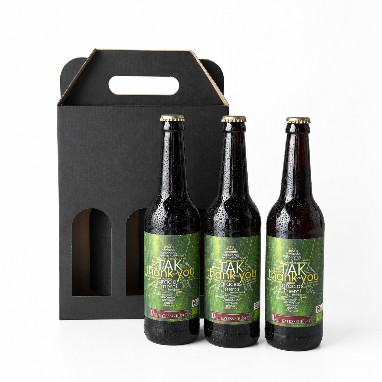 Gaveæske med 3 flasker ‘TAK’ øl fra Grauballe Bryghus, designet af Delikatessehuset som en gave til at sige tak.