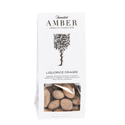 Hvid pose med Summerbird Amber Liquorice Dragée, økologiske mandler med karamelliseret chokolade og lakrids.