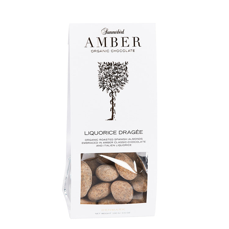 Hvid pose med Summerbird Amber Liquorice Dragée, økologiske mandler med karamelliseret chokolade og lakrids.