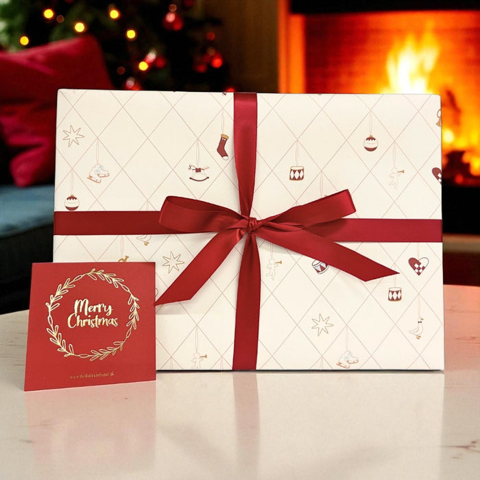 Flot gaveløsning indpakket i gavepapir med julemotiv, helt perfekt som julegave med kort til jul 